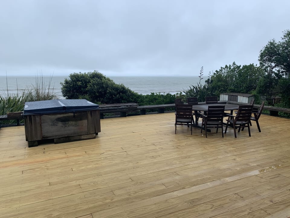 Deck with spa and big out door dinning furniture. Also big umbrella available.