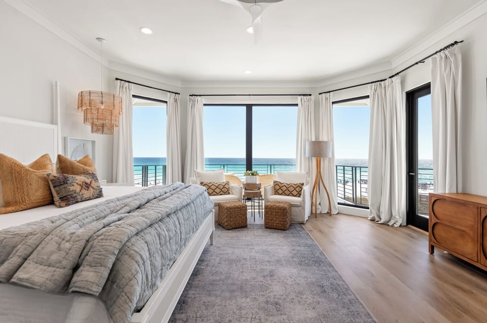 The master bedroom has access to the balcony where you can relax on the lounge chairs.