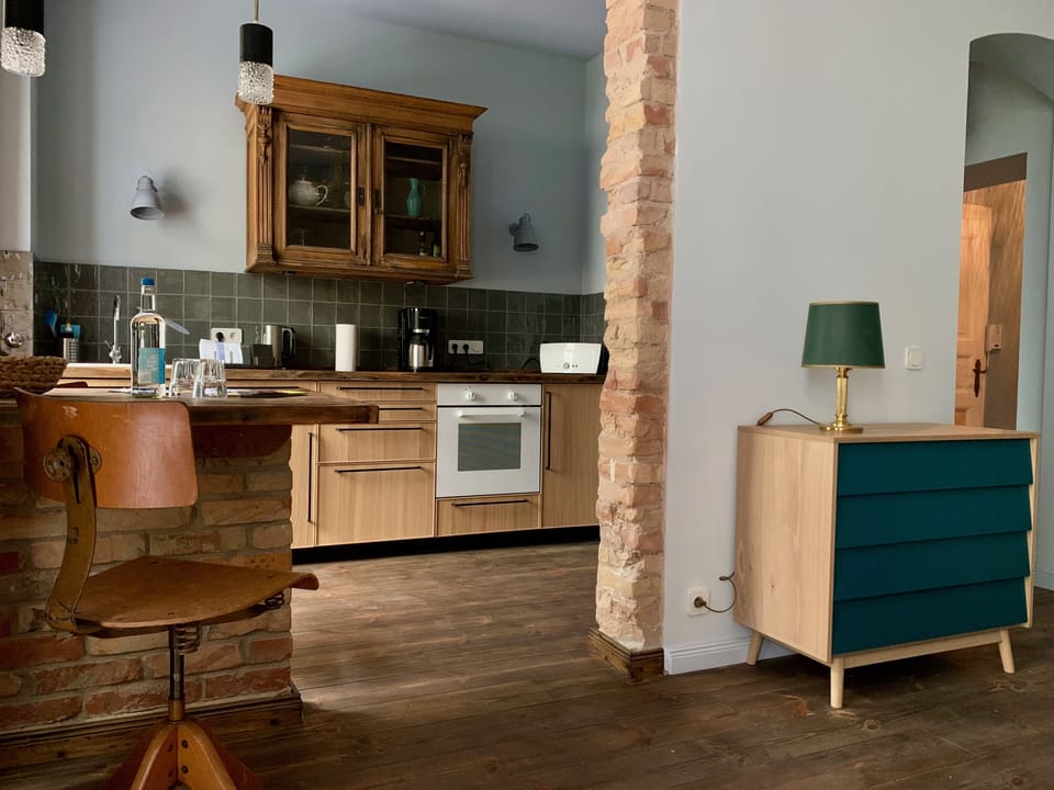 One-Bedroom Studio Patio | Premium bedding, desk, laptop workspace, blackout drapes