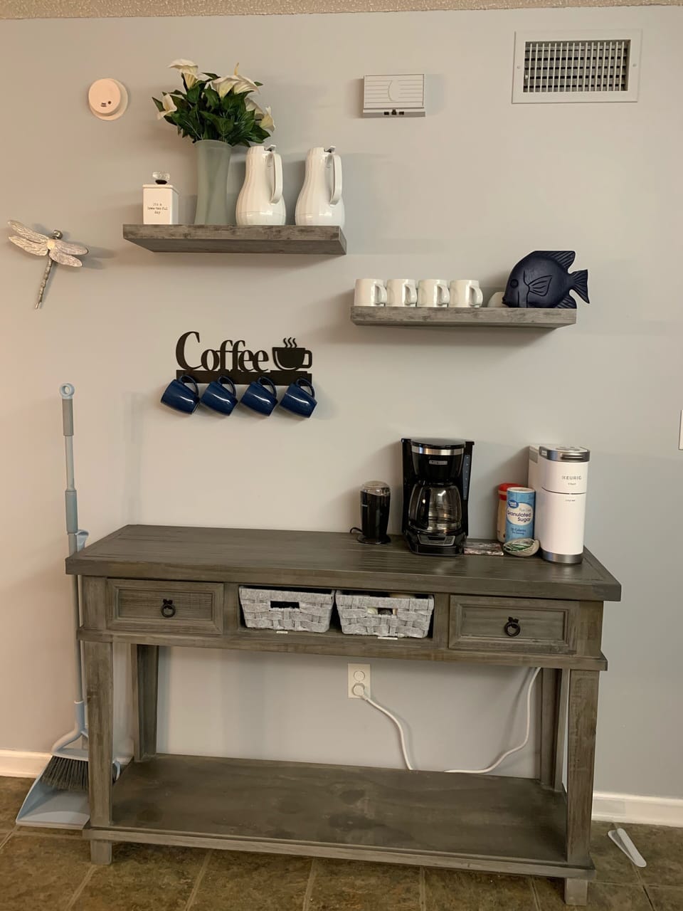 Coffee bar has Keurig & drip pot with coffee/tea/hot cocoa, creamer & sweetener.