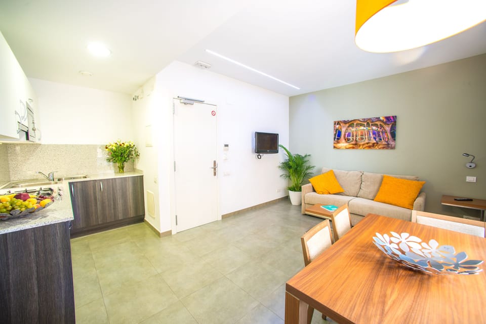 Standard Apartment, 1 Bedroom (4 pax) | Living area | 32-inch flat-screen TV with satellite channels, TV