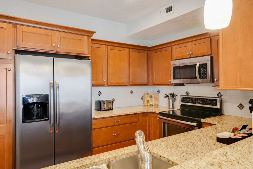 Kitchen flows seamlessly into the main living and dining areas
