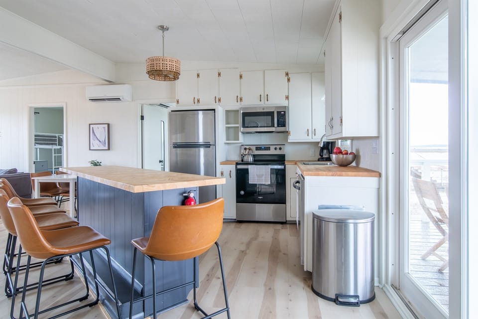 Newly renovated kitchen. All new stainless steel appliances. Butcher block bar that seats 5, plus table that seats 4.