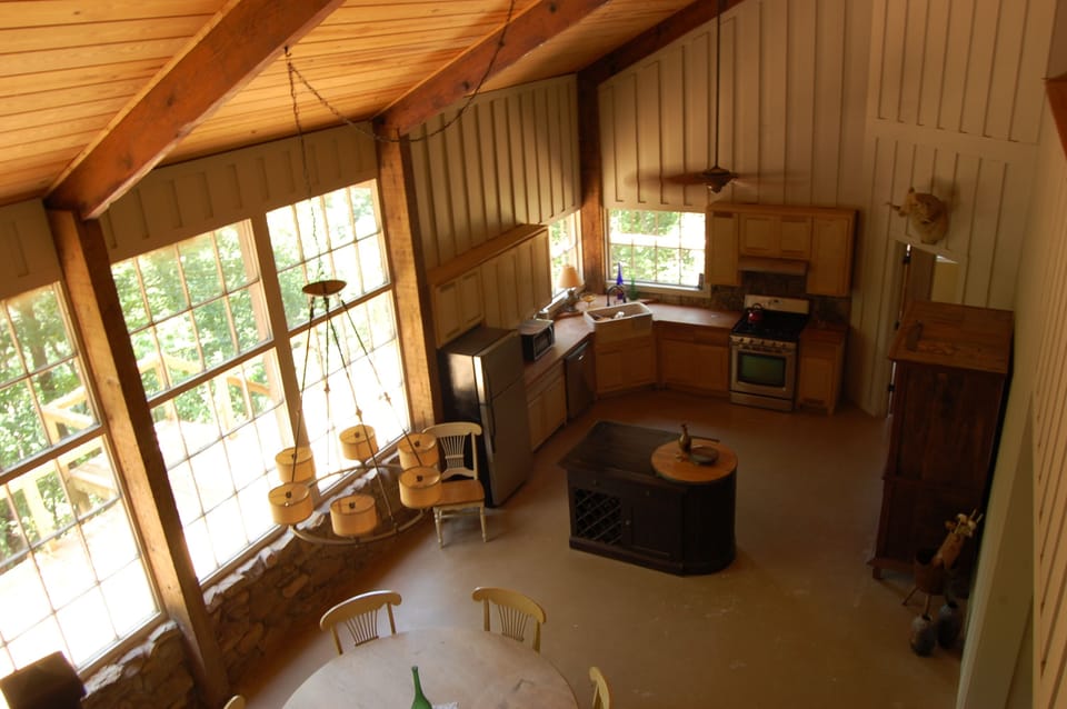View of the kitchen and dining area, taken from the loft