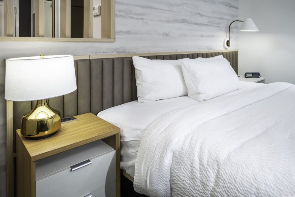 Down comforters, desk, blackout drapes, iron/ironing board