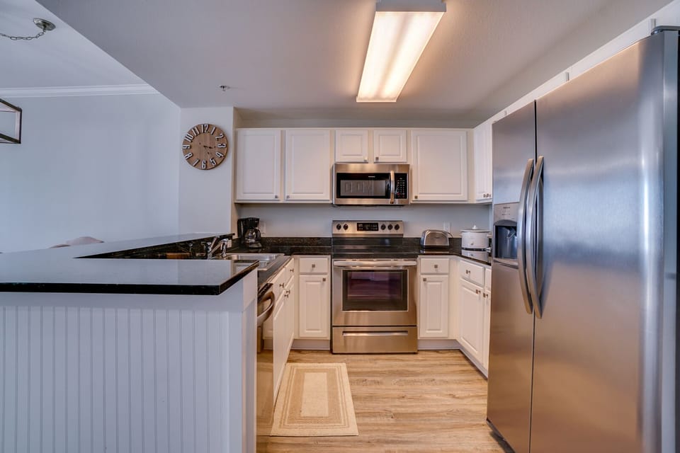 Your fully equipped kitchen features stainless steel appliances, granite countertops, and everything you need to prepare delicious meals during your stay.