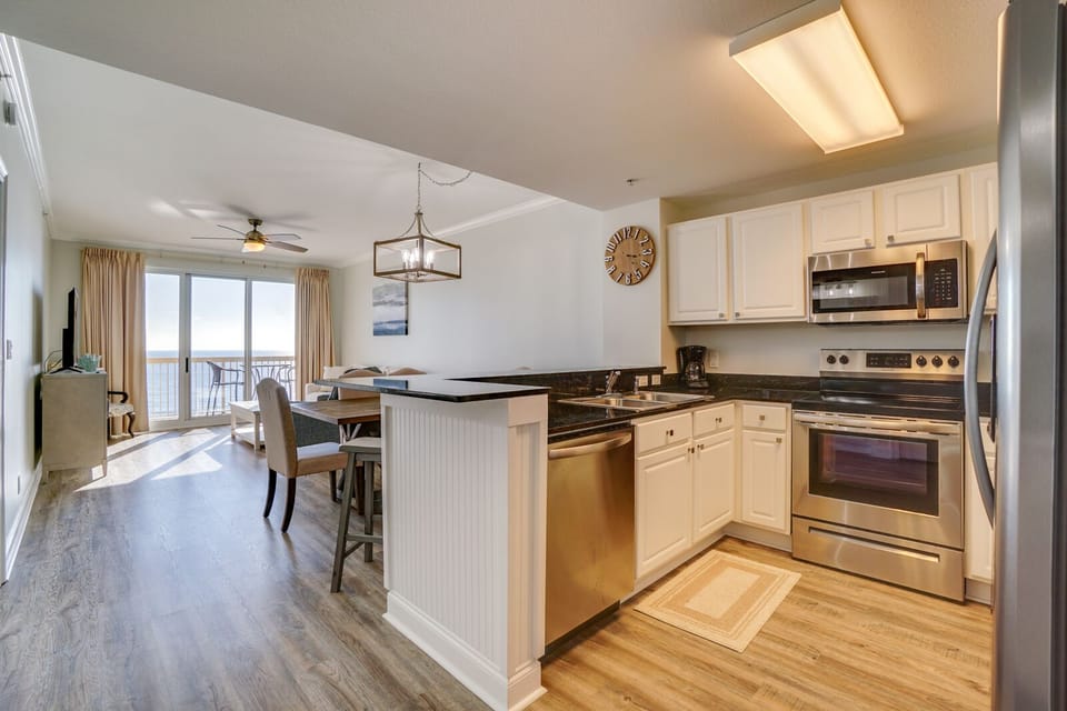 Your modern kitchen flows seamlessly into the bright living space, perfect for cooking while chatting with friends at the breakfast bar.