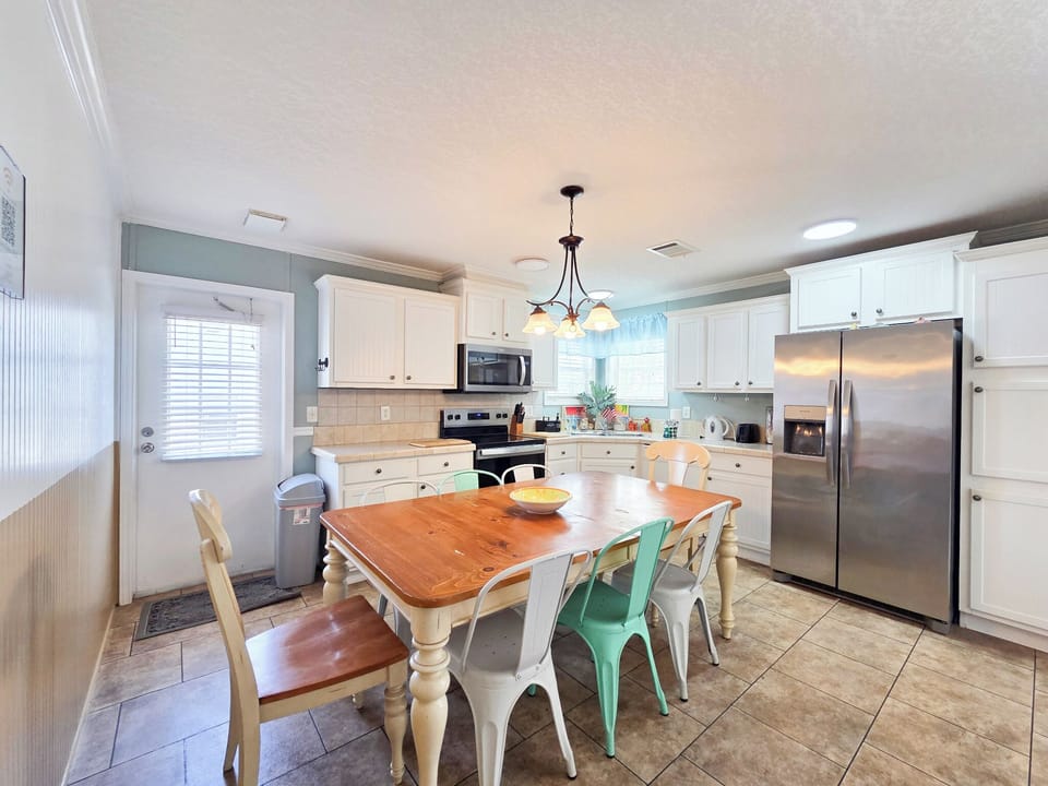 Full kitchen with glass top stove and oven, dishwasher and more.
