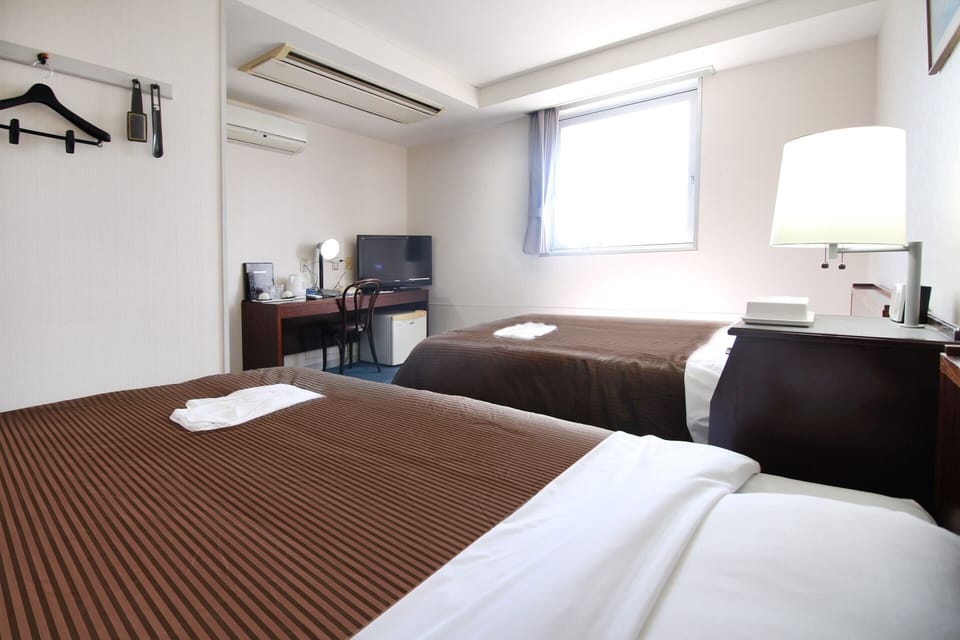 Desk, blackout drapes, bed sheets