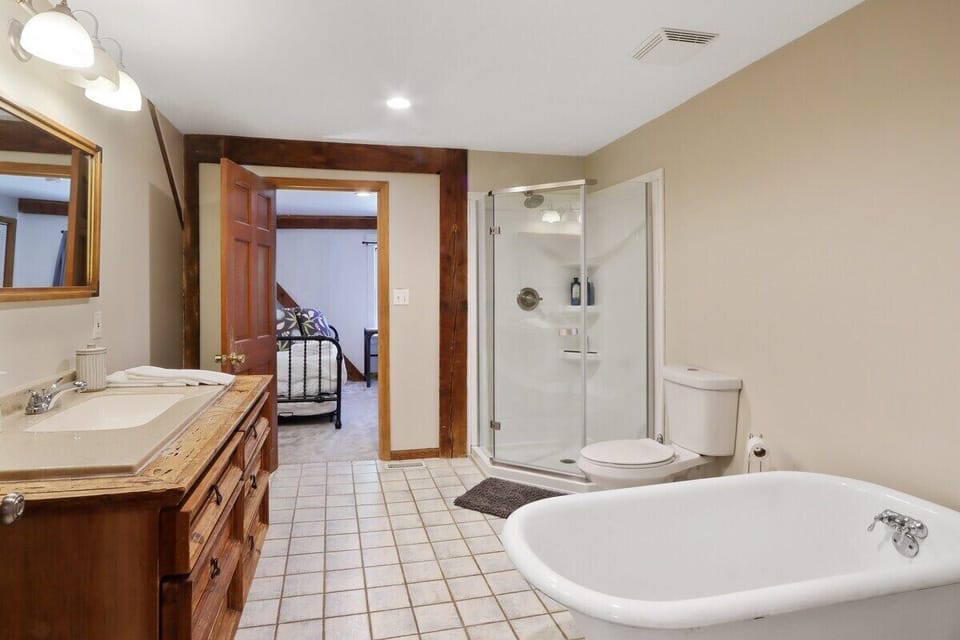 Shared full bath with shower/tub on first floor