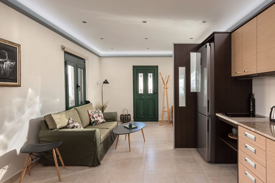 Exclusive Villa | Living area | 42-inch flat-screen TV with satellite channels, TV, fireplace