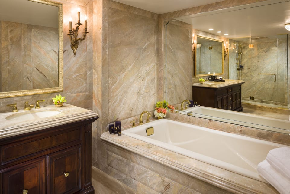 Presidential Suite | Bathroom | Designer toiletries, hair dryer, bathrobes, slippers
