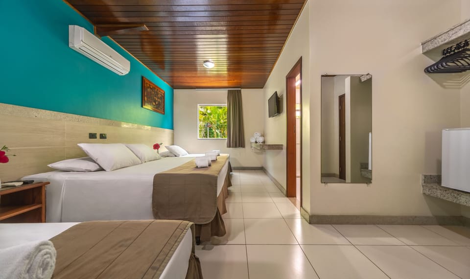 Deluxe Quadruple Room | Minibar, in-room safe, blackout drapes, free WiFi