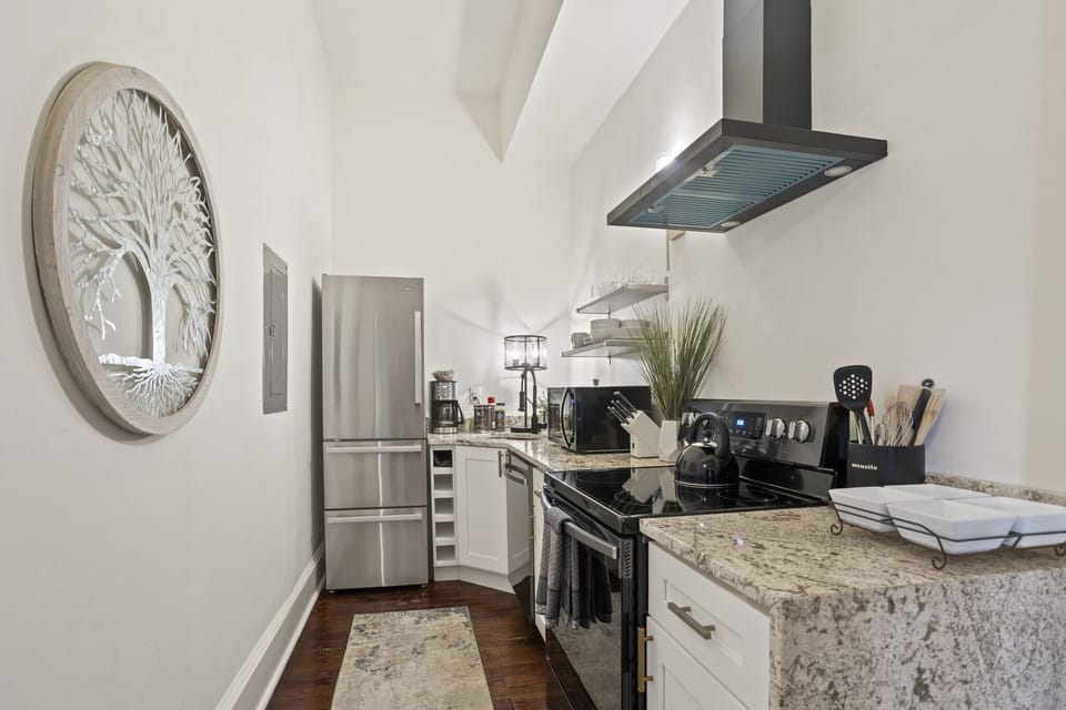 1st Floor Front Kitchen Complete with Electric Range, Dishwasher, and Refrigerator. 
