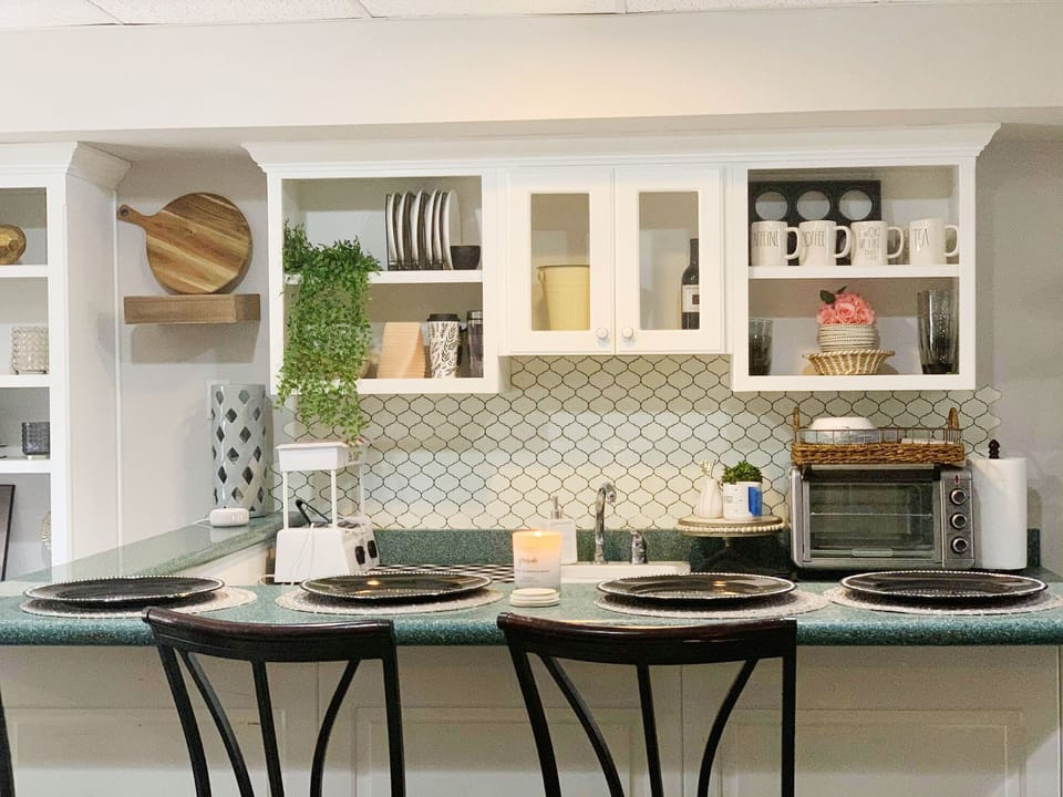 Kitchenette bar sits 4. Nicely equipped. Toaster oven, hot plate, Keurig, &pans.