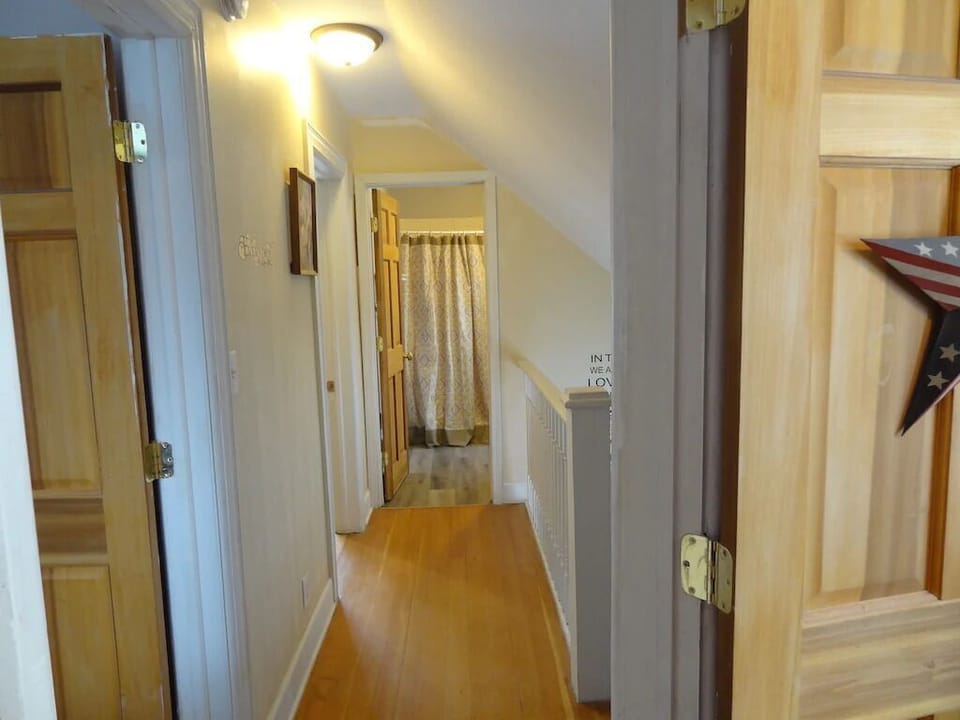 Hallway upstairs. 3 bedrooms and a bathroom.