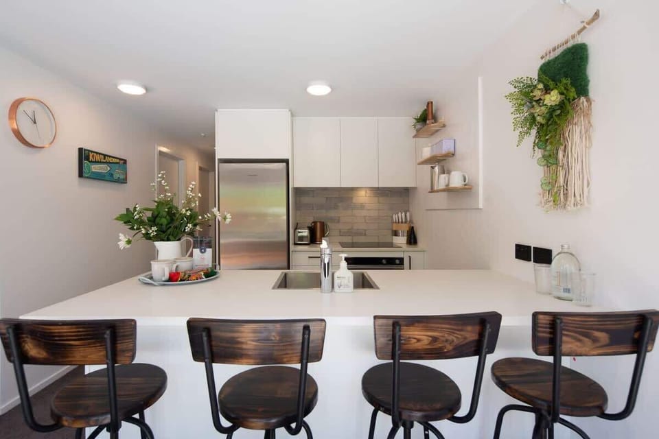 Modern Kitchen: Fully Equipped Culinary Haven
This sleek, modern kitchen features high-end appliances, ample counter space, and all the essentials you need to prepare delicious meals during your stay. 