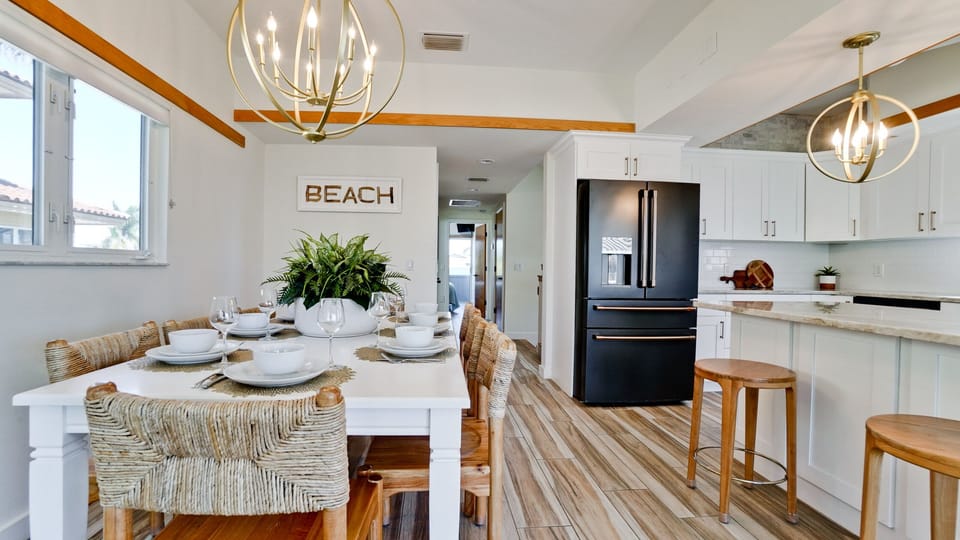 Spacious open floor plan includes dining area for 8 and kitchen seating for two