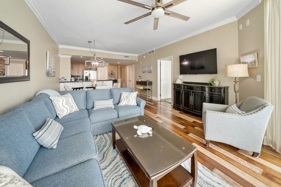 Sink into plush seating and enjoy movie nights on your large flat-screen TV while hardwood floors and coastal decor create your perfect home away from home.