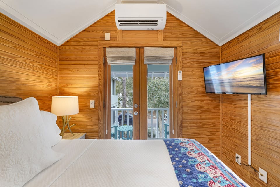 DOUBLE DOORS TO FURNISHED COVERED BALCONY