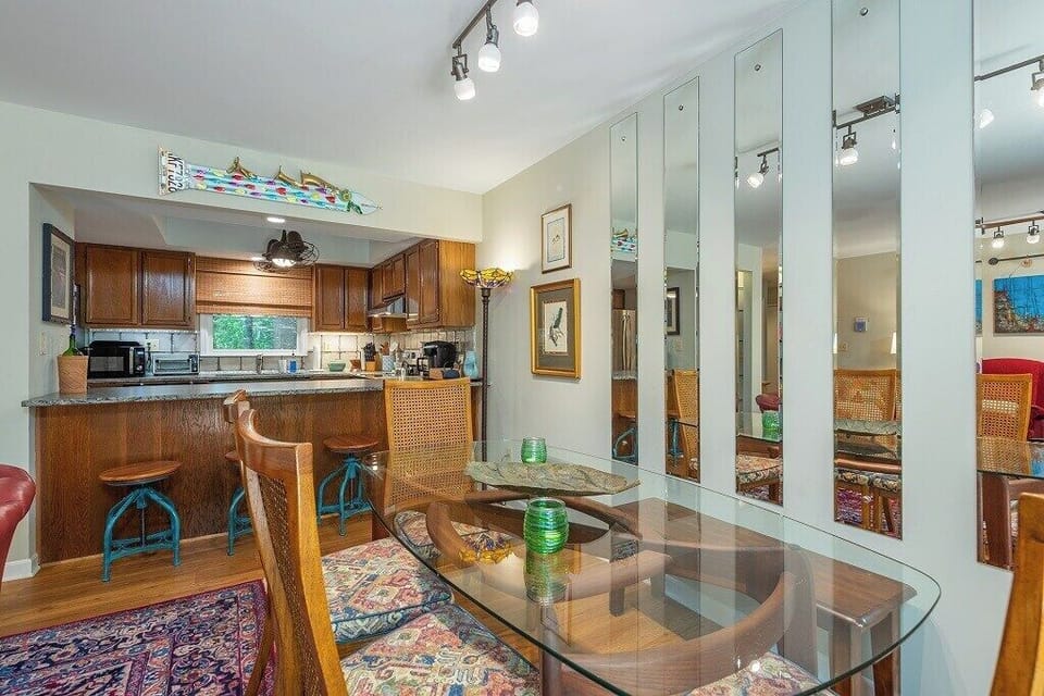 Imagine gathering around at this glass top dining room table.