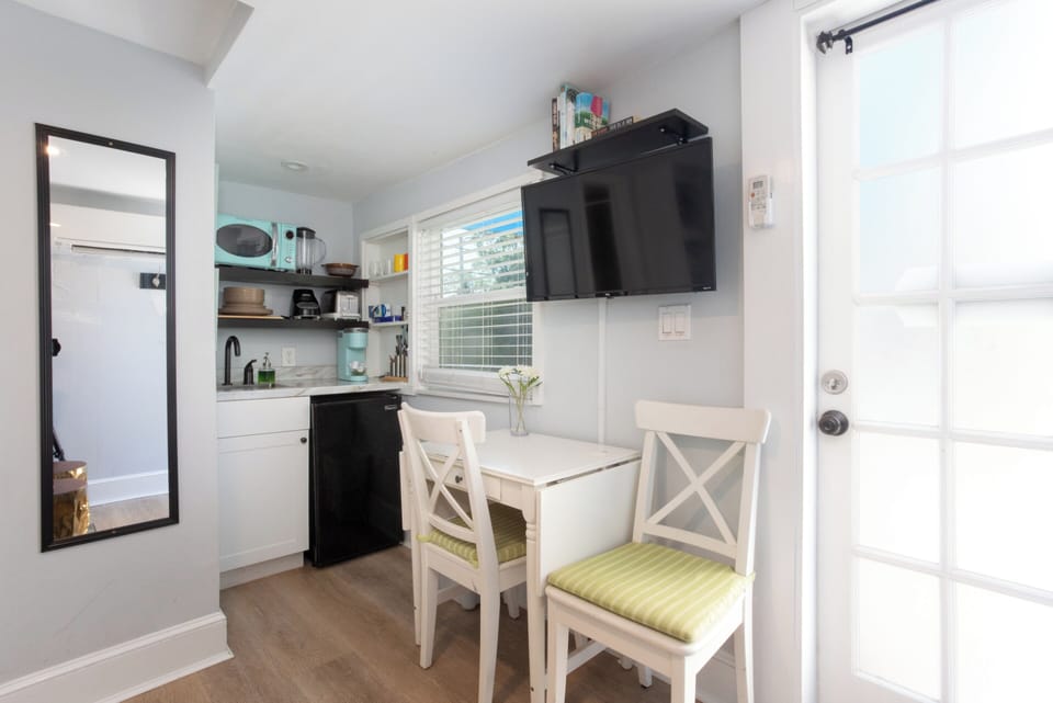 dining/office area off kitchen area across from bed