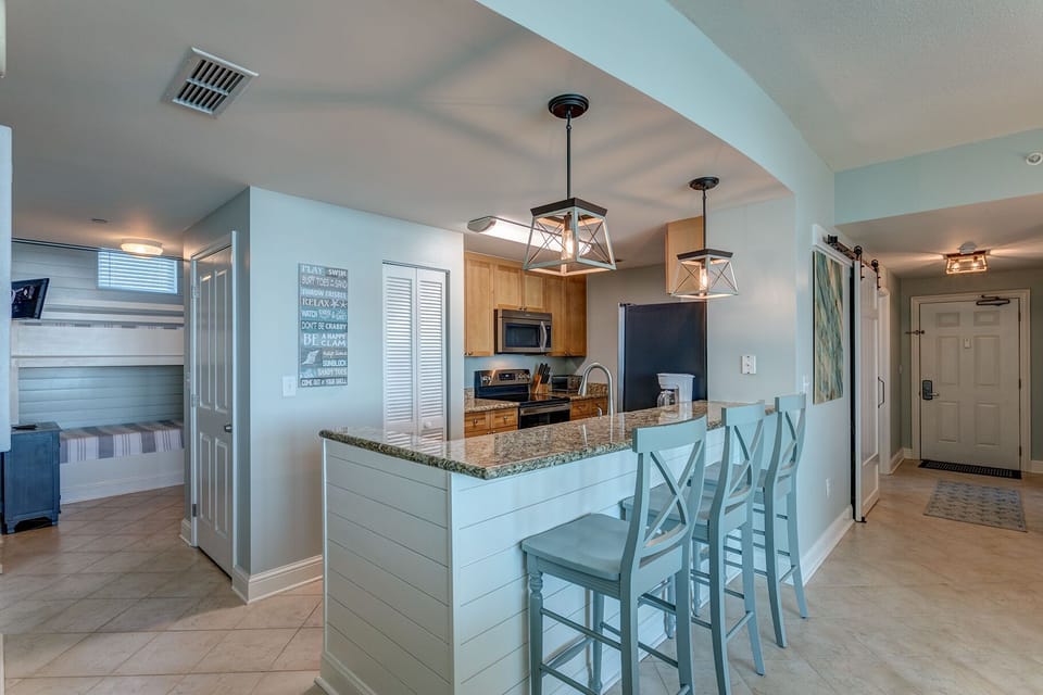 Open floor plan with large eat at bar