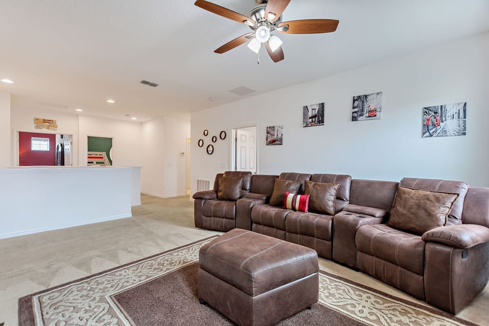 2nd floor sitting area with TV and large sofa