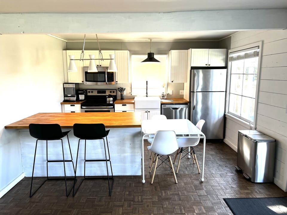 Full sized and fully stocked kitchen with cookware, utensils, and spices. 