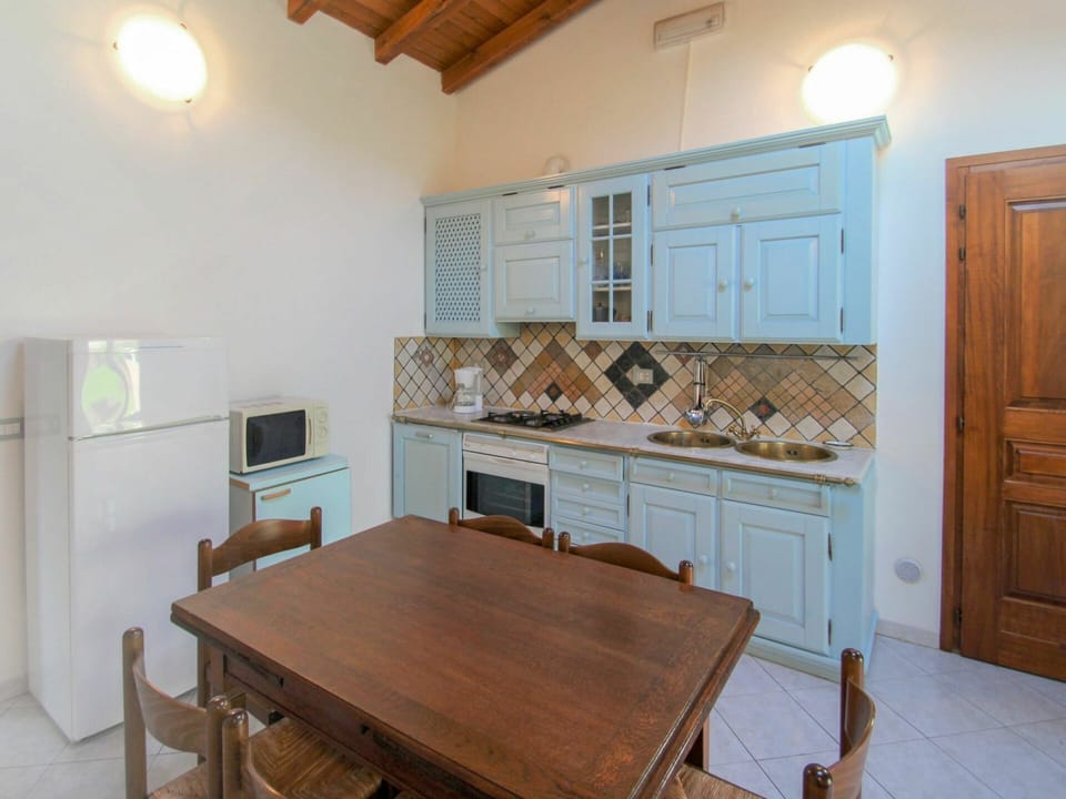 Furniture, Property, Table, Cabinetry, Wood, Lighting, Interior Design, Wood Stain, Chair, Floor