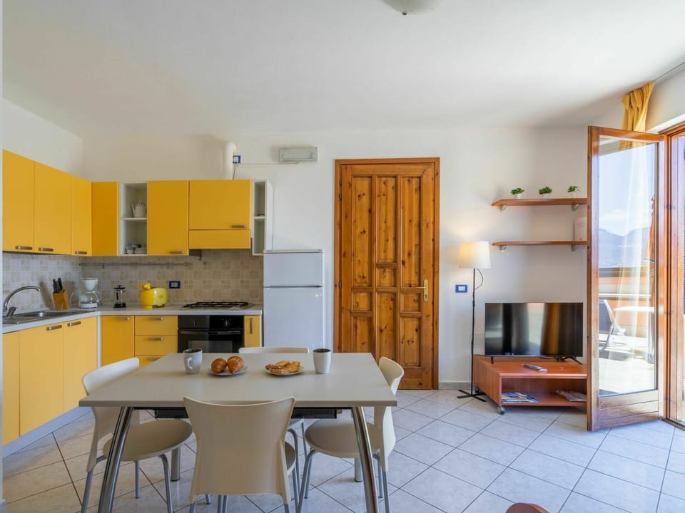Cabinetry, Furniture, Table, Property, Countertop, Chair, Wood, Kitchen, Orange, Lighting