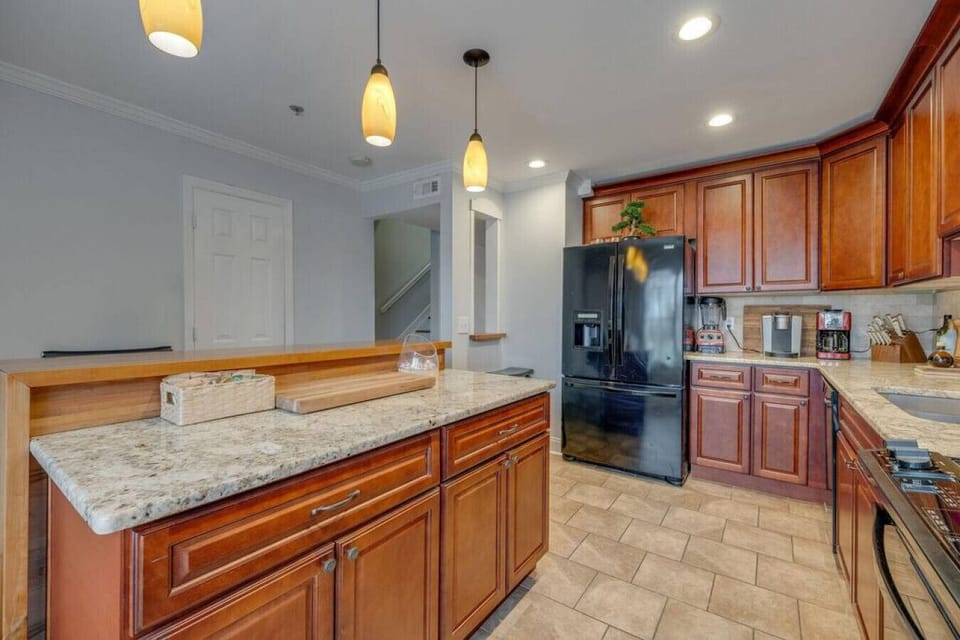 Coffee machine, blender, and kitchen basics included.