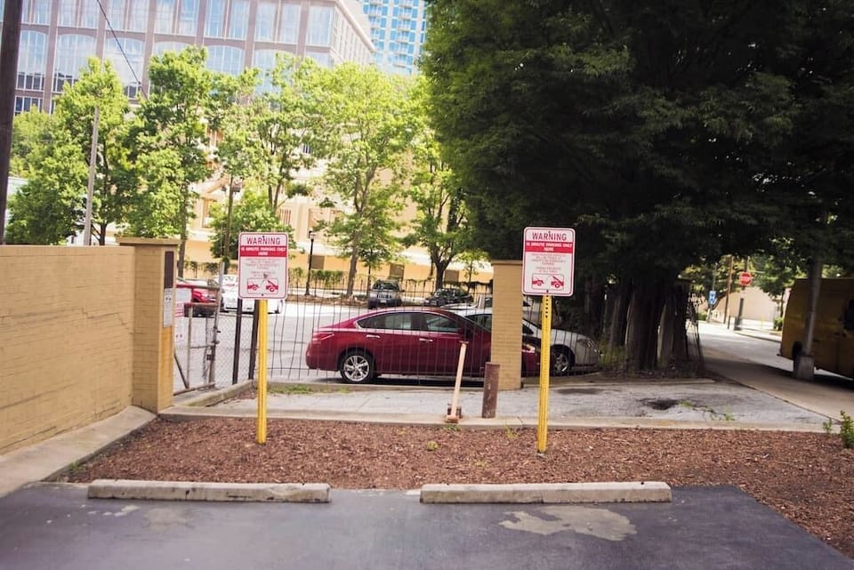 15 Min Parking Located on the North East Corner of the building off W. Peachtree