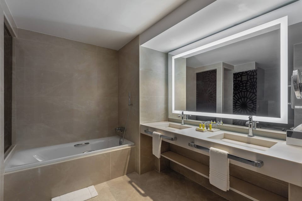 Executive Suite, 1 Bedroom, Smoking | Bathroom | Shower, free toiletries, hair dryer, bathrobes