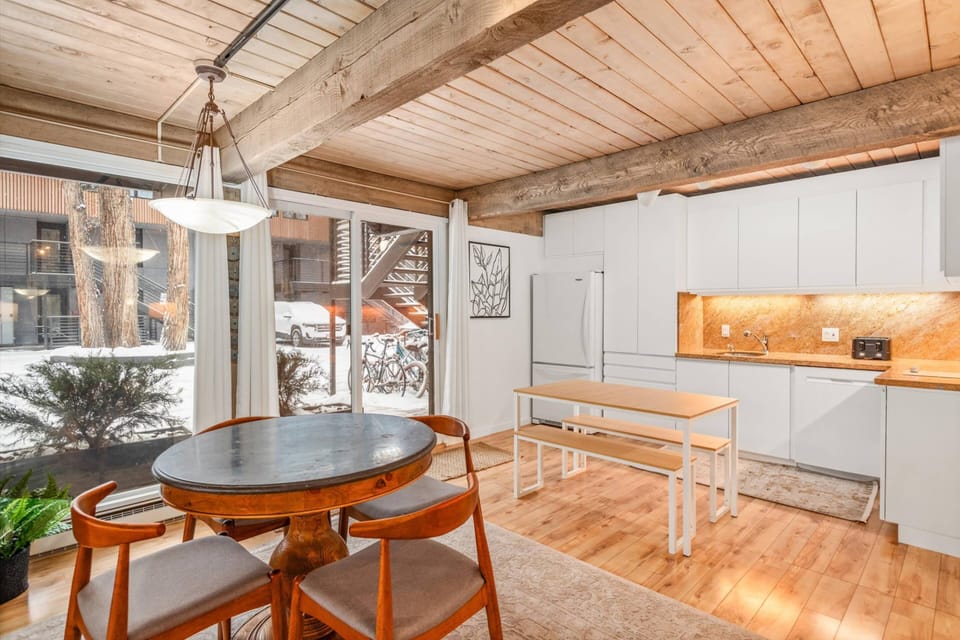 A dining table for 4 and a kitchen work station allow for comfortable spots for remote work, light breakfast or casual happy hour!