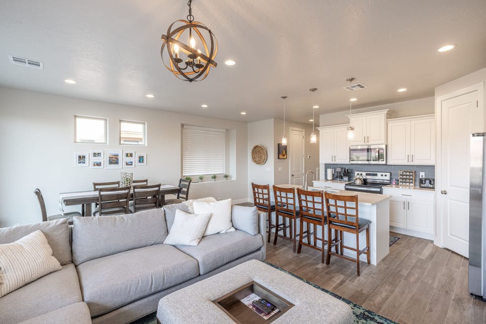 Living Room - The Kitchen Island comfortably seats 4 adults and creates a great space for serving and preparing meals.