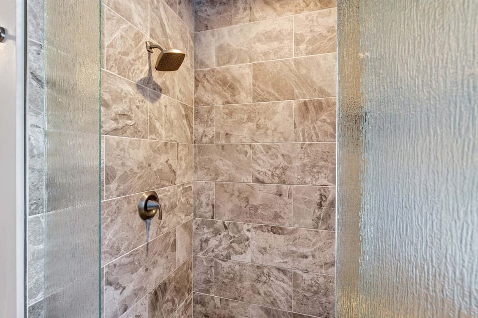 En suite bath with walk-in shower.
