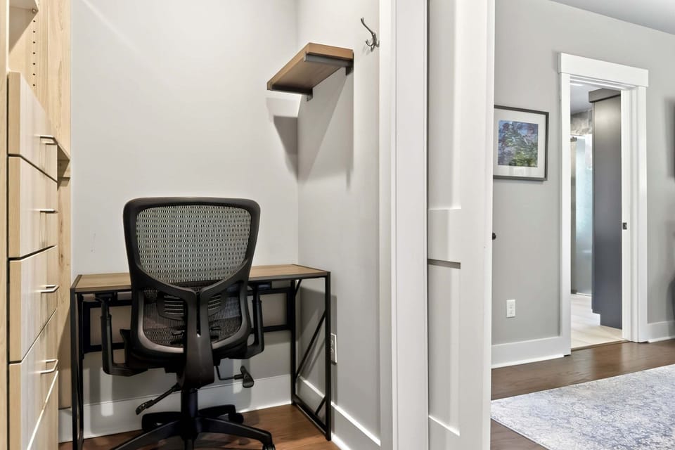Laptop-friendly dedicated workstation in the primary suite's walk-in closet.