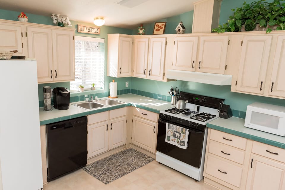 Stocked kitchen with fridge, dishwasher, oven, stove, microwave, Keurig and more