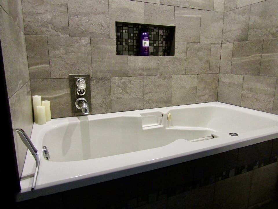 Jetted spa tub and rain shower in the second bathroom.