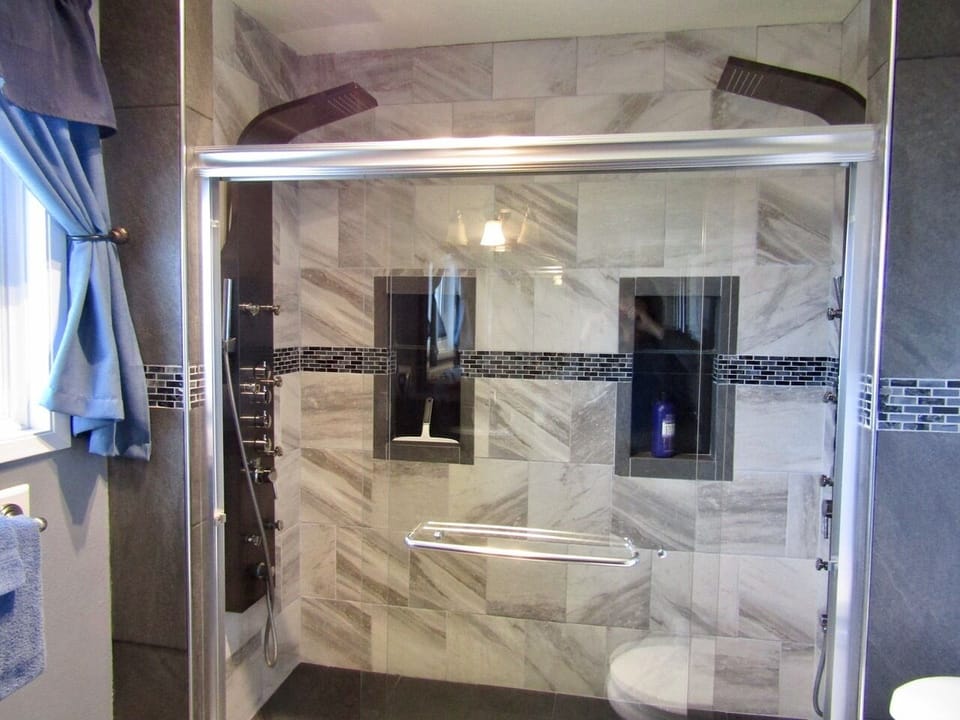 En Suite Master bath with dual head rain shower and a heated seat.

