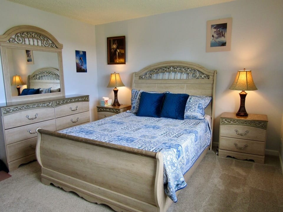 Master Suite with Queen bed and a water view.