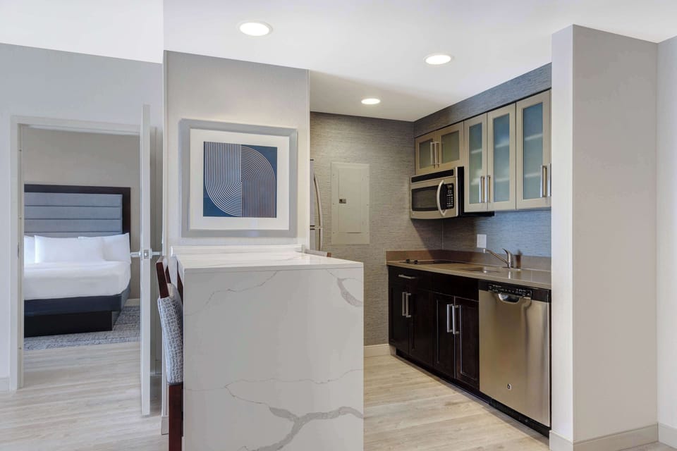 Suite, 2 Queen Beds, Non Smoking (Large) | Private kitchen | Full-size fridge, microwave, stovetop, dishwasher