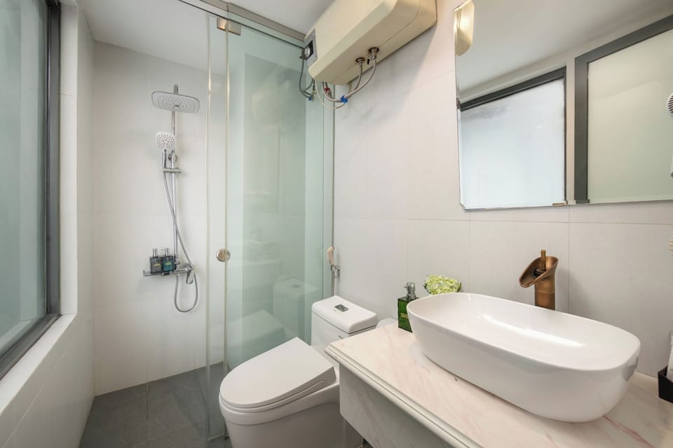 Shower, free toiletries, hair dryer, slippers