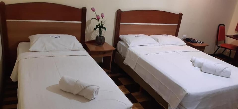Triple Room | Minibar, desk, blackout drapes, bed sheets
