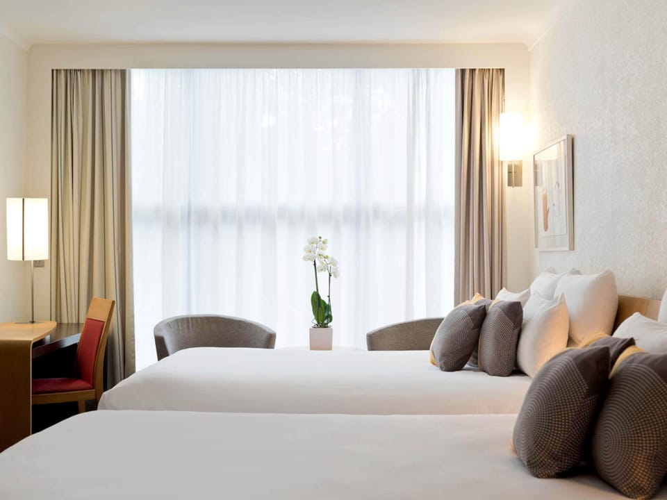Family Room, 2 Double Beds | Down comforters, minibar, in-room safe, desk