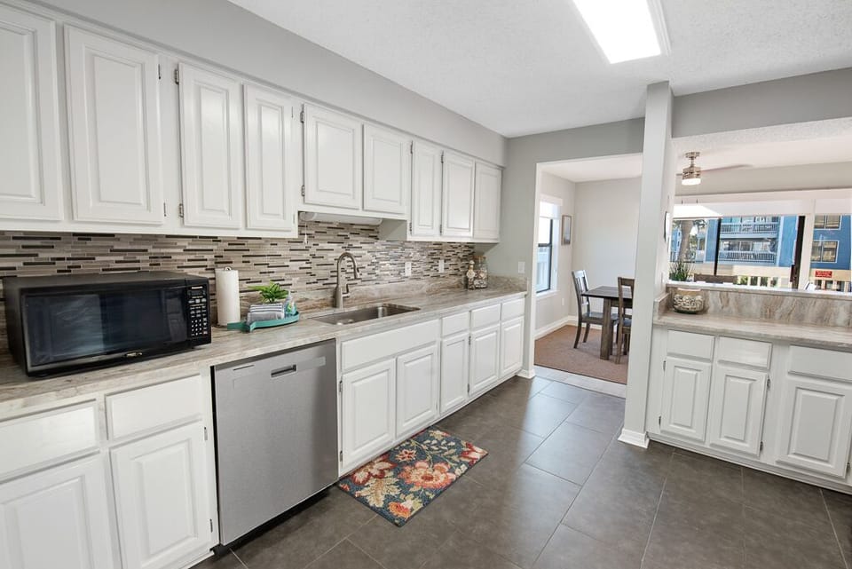 Condo, 3 Bedrooms, Balcony, Pool View (Pet Friendly – B105) | Private kitchen | Full-size fridge, microwave, oven, stovetop