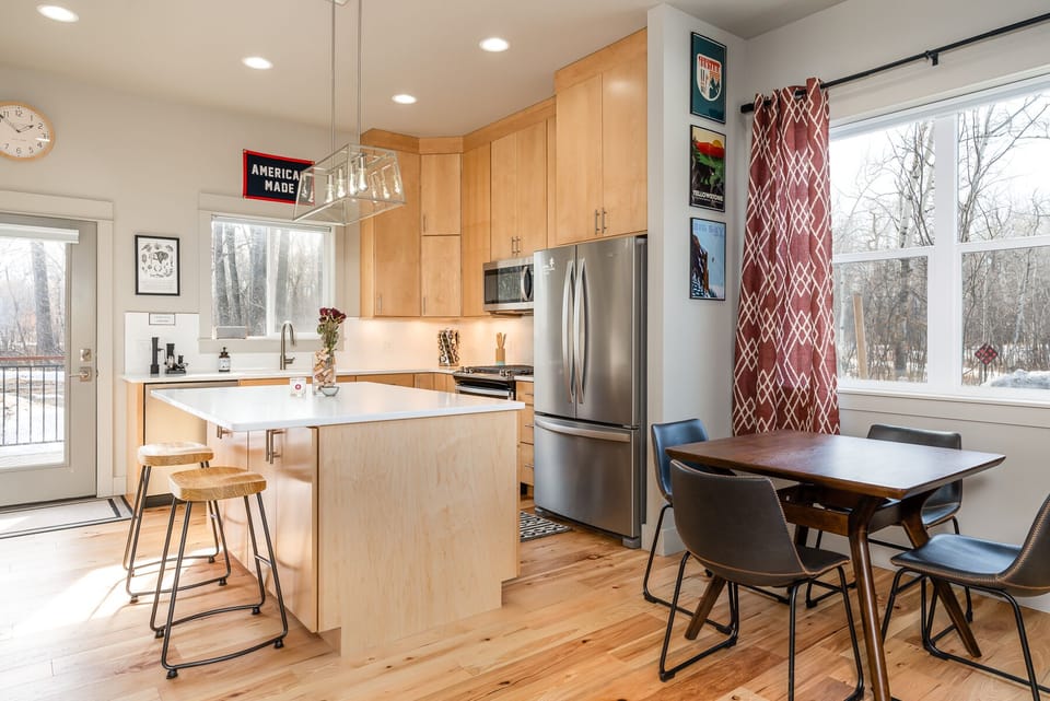 Open concept living, dining and kitchen area.