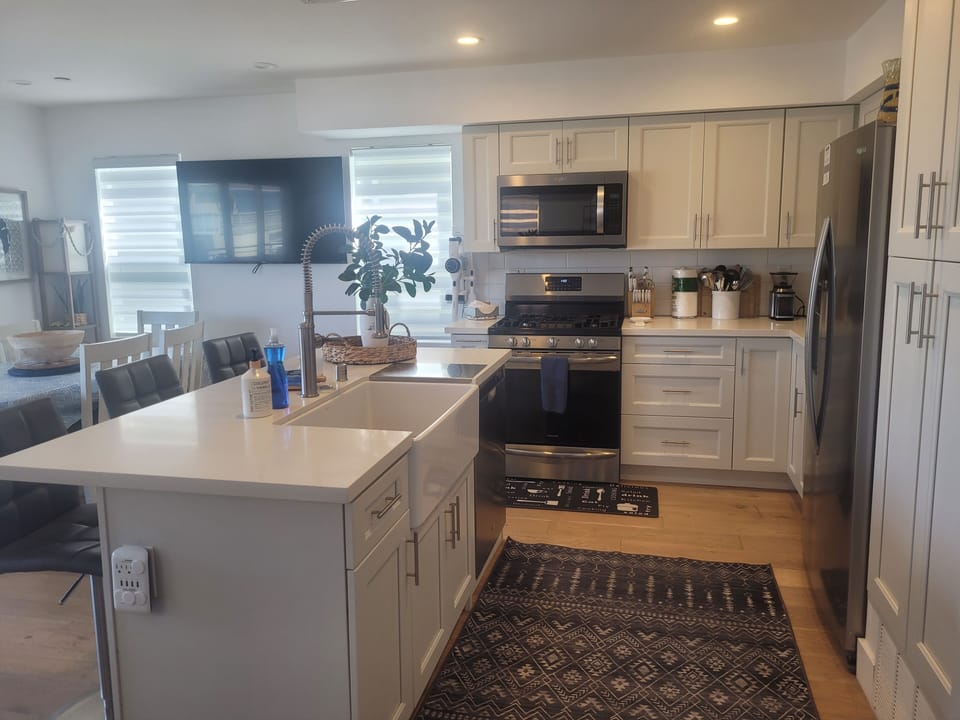  Efficiently designed kitchen stocked with utensils and tools to enhance your cuisine. 
