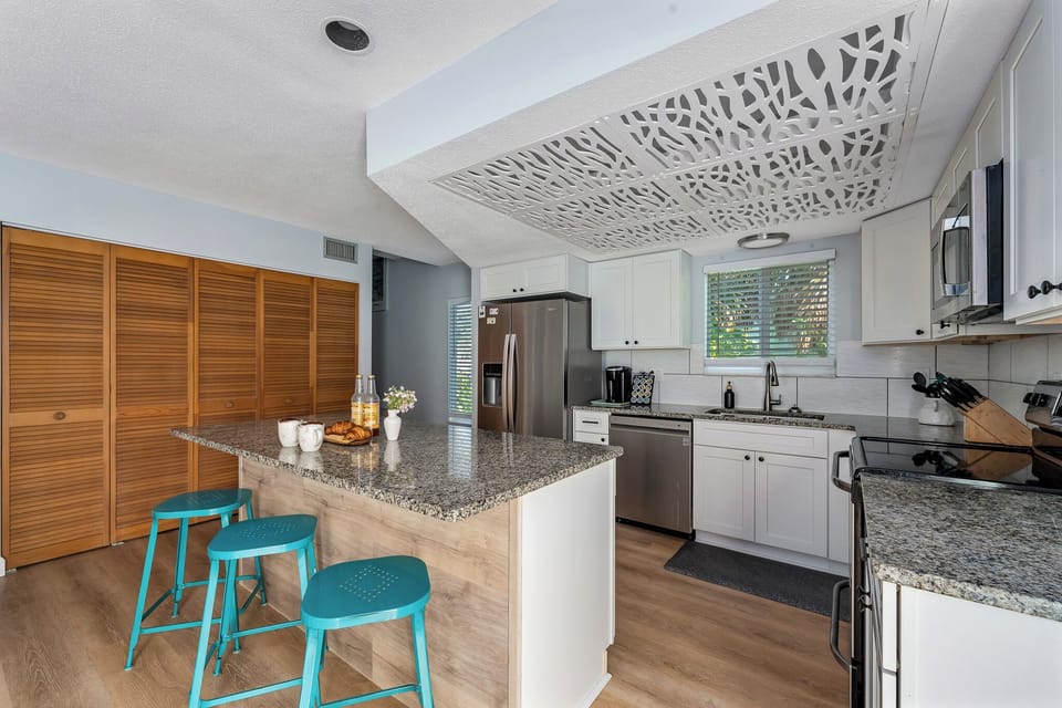 Sleek granite countertops provide plenty of space for food prep.